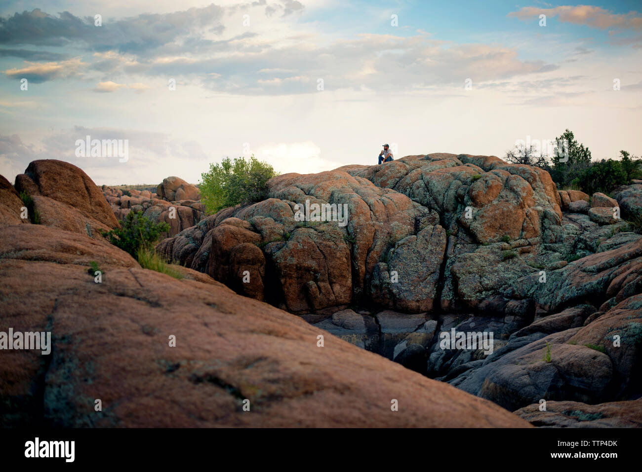 Old man sitting on rock hi-res stock photography and images - Alamy