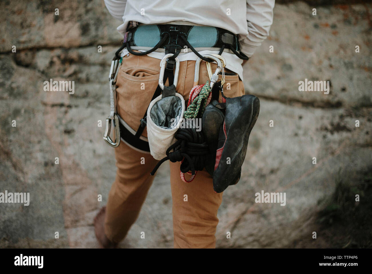 Rear view of man with climbing equipment Stock Photo