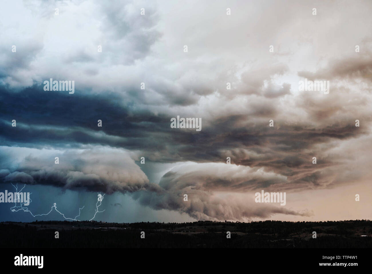 Idyllic view of thunderstorm lightning over landscape Stock Photo