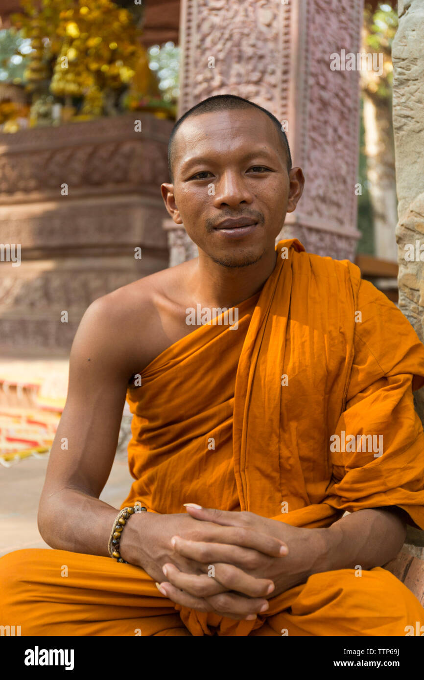 close up portrait of monk in temple in Cambodia Stock Photo