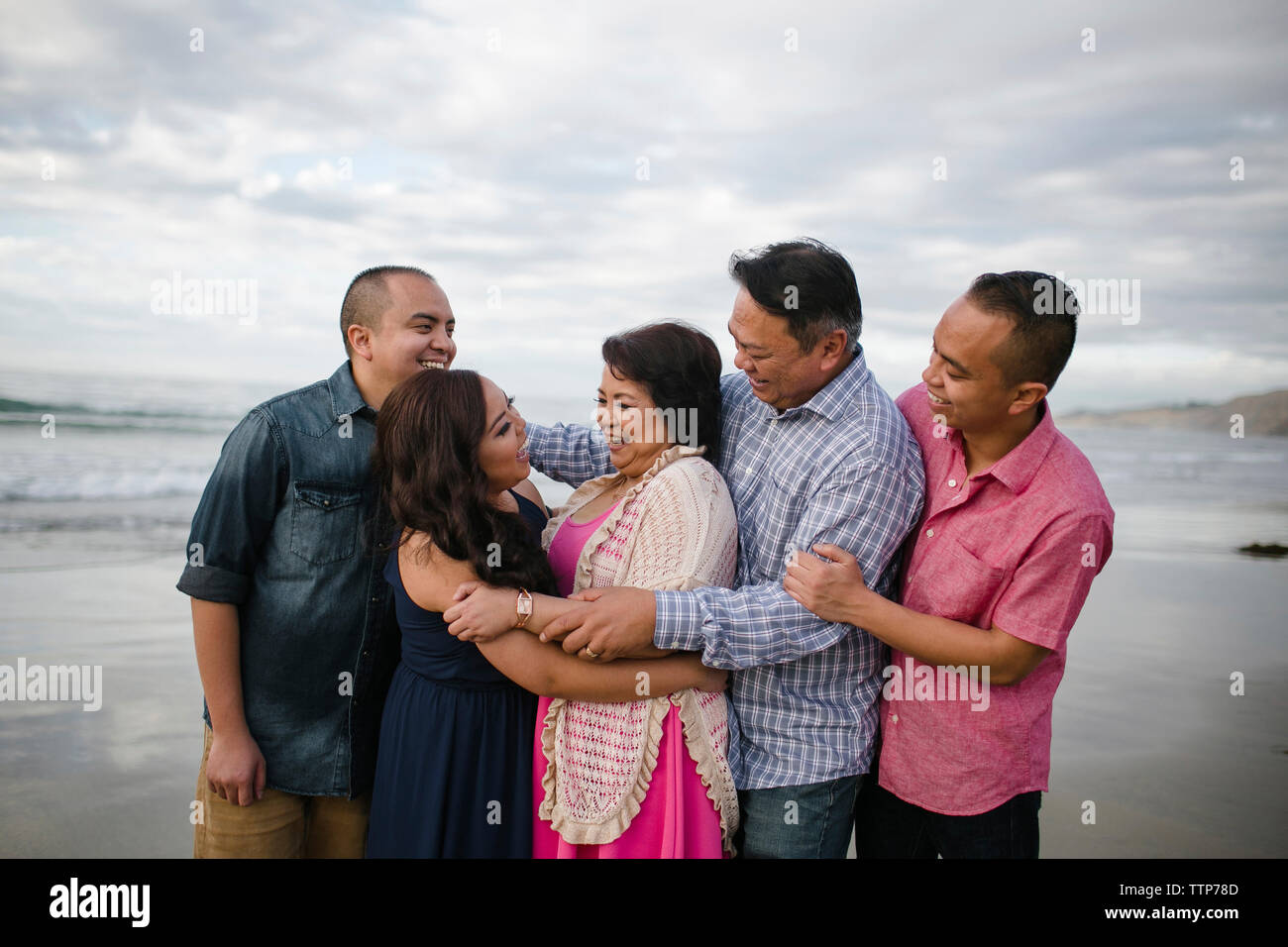 Young asian family on the beach hi-res stock photography and images - Alamy