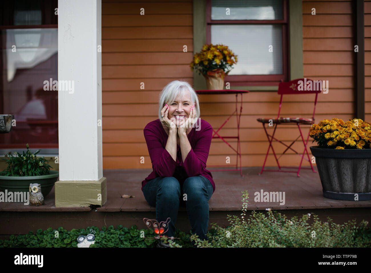 Woman sitting on her porch hi-res stock photography and images - Alamy