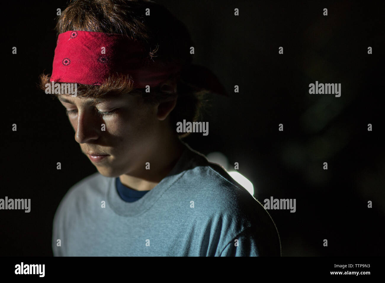 Close-up of young man looking down Stock Photo