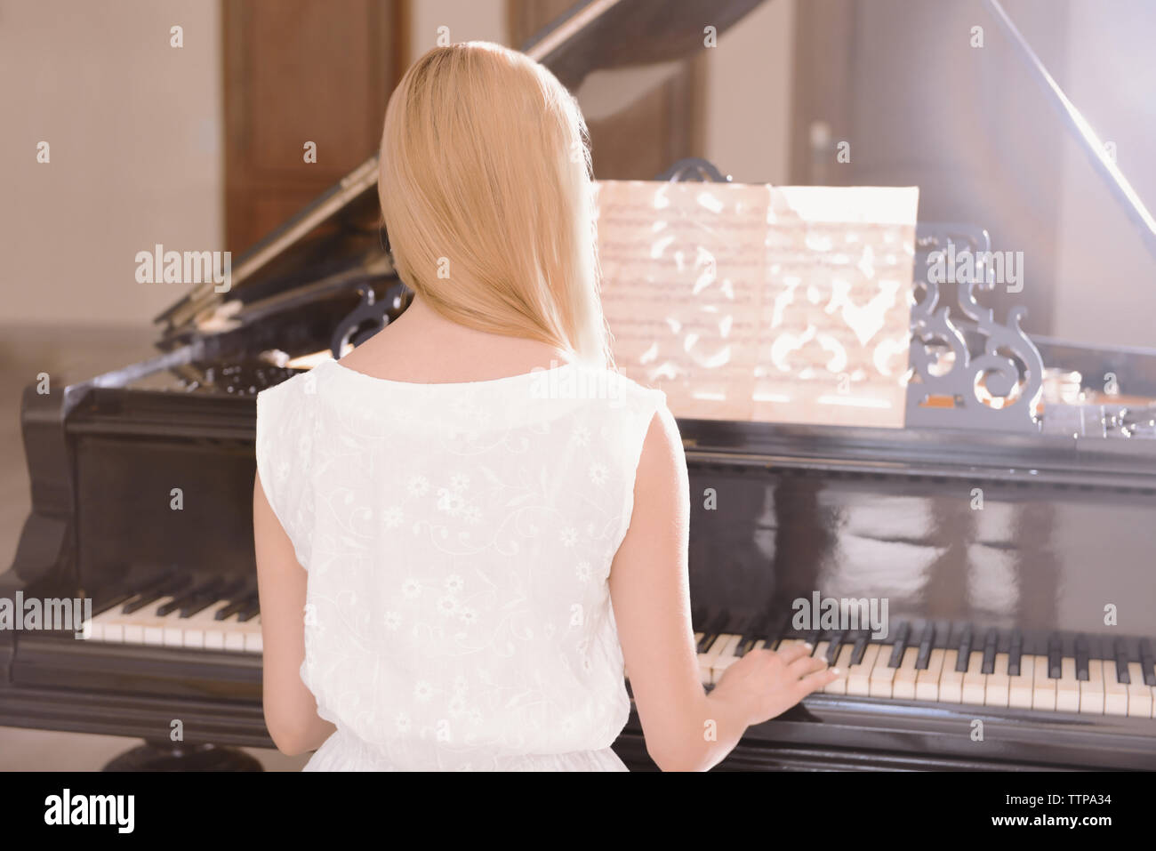 Girl Playing Piano Stock Photo Alamy