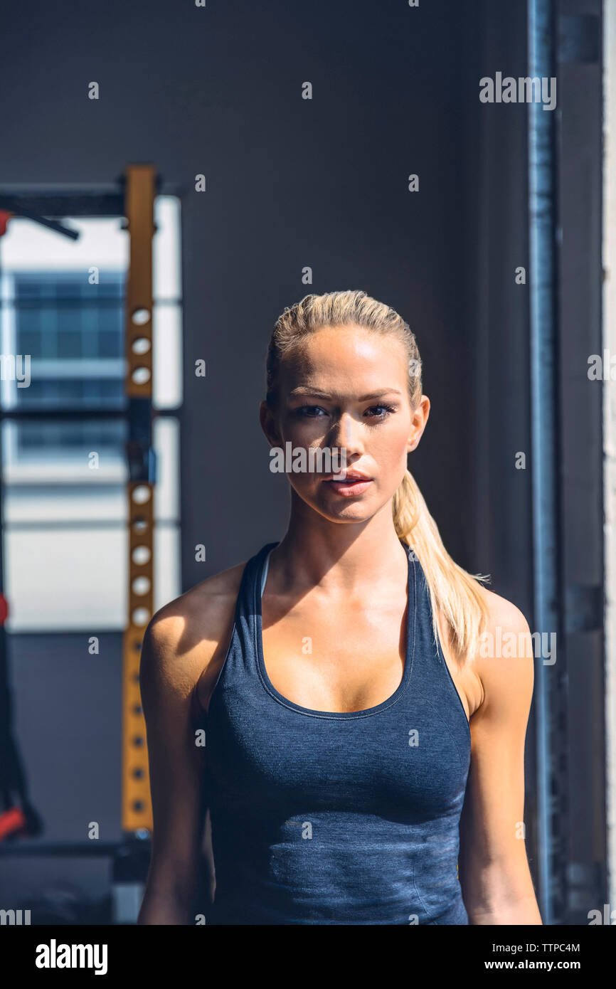 Confident woman standing gym hi-res stock photography and images - Alamy