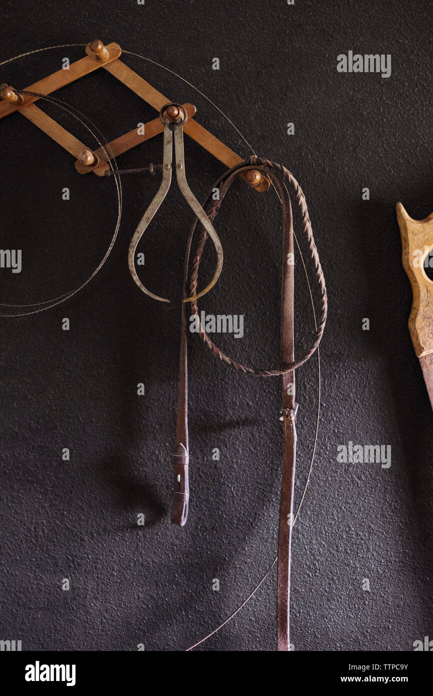 Work tools hanging on wall Stock Photo