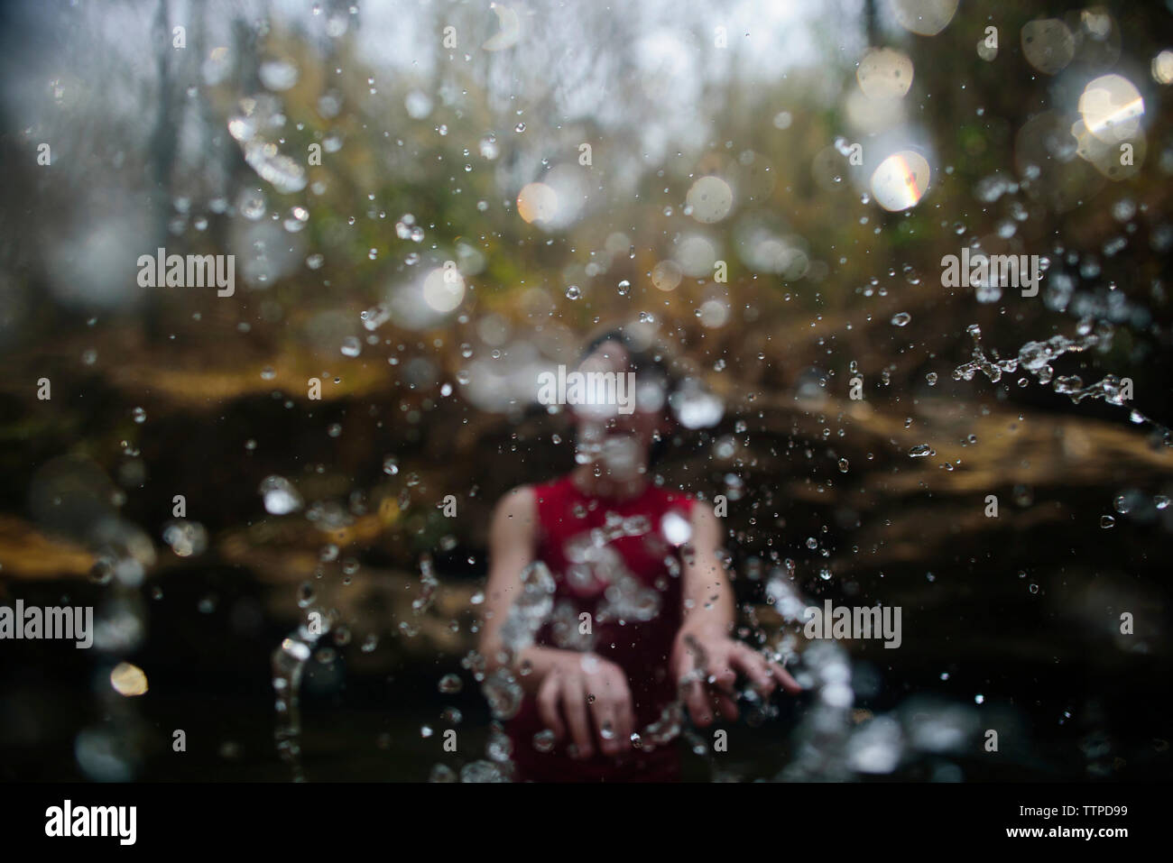 Boy playing in river hi-res stock photography and images - Alamy