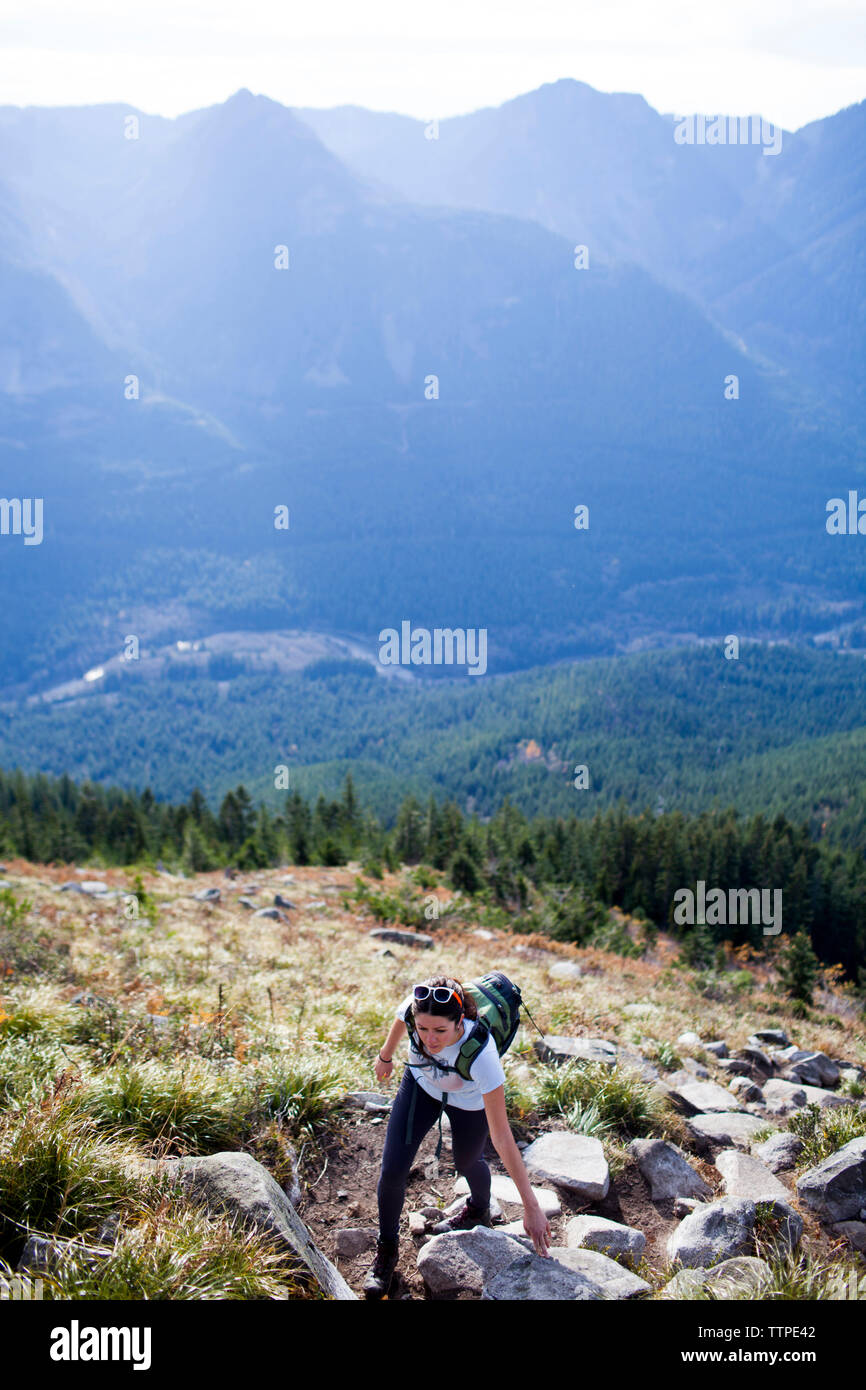 Woman climbing the rocks hi-res stock photography and images - Alamy