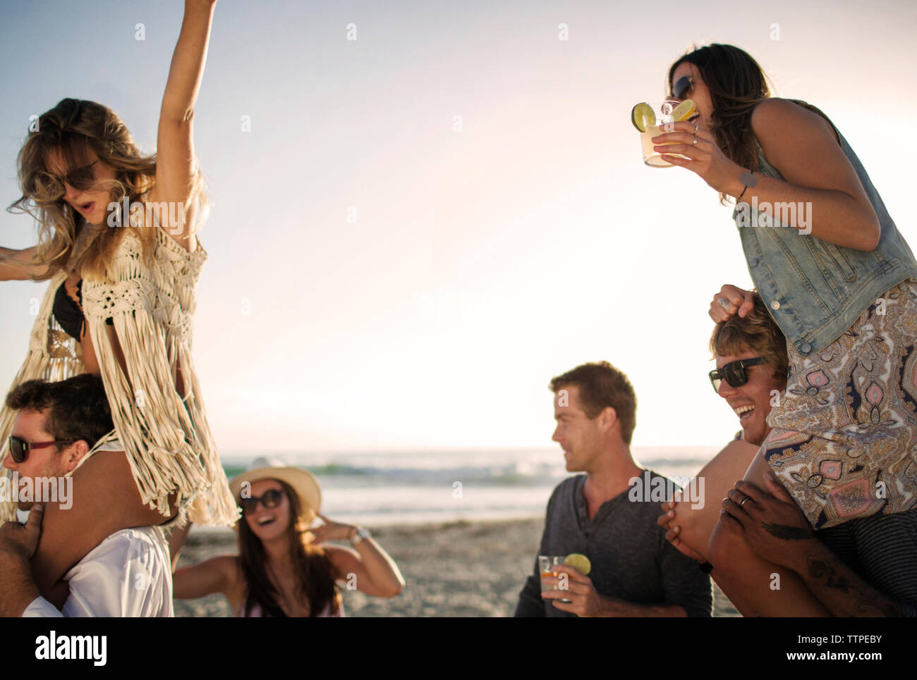 Cheerful friends enjoying on beach Stock Photo