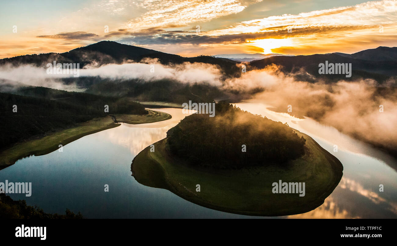 Misty sunrise at Alagon River Meander. This place is called The Melero and is not far from Riomalo de Abajo, Hurdes, Spain Stock Photo