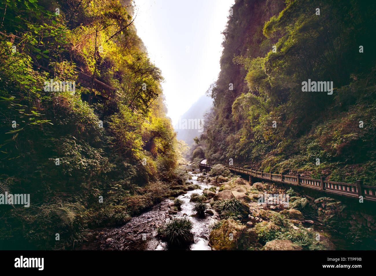 View of river flowing amidst mountains in Hubei Stock Photo