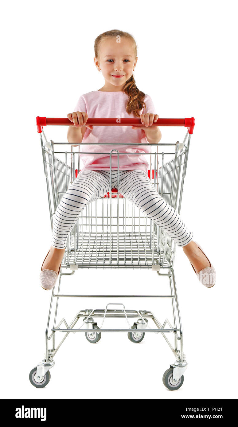 Cute girl sitting in shopping cart on white background Stock Photo - Alamy
