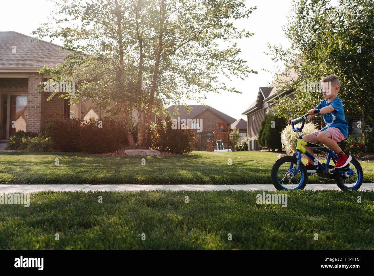 Boy bicycle side view hi-res stock photography and images - Alamy