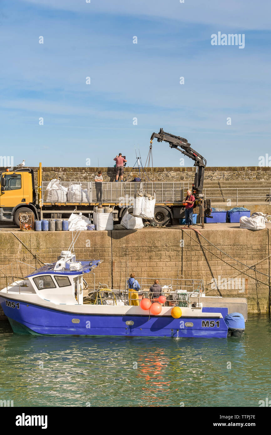 Crane lifting small boat hi-res stock photography and images - Alamy
