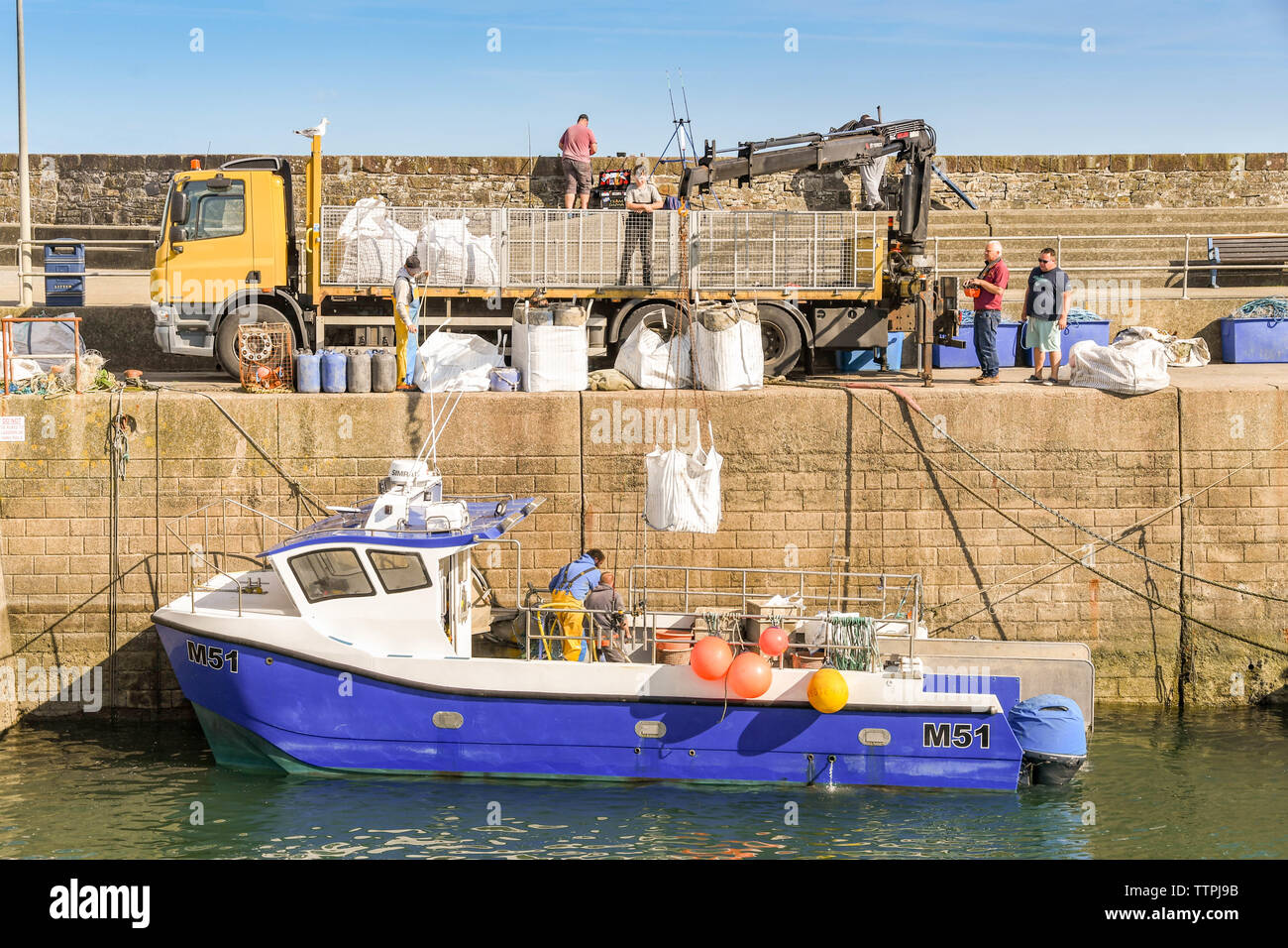 Crane lifting small boat hi-res stock photography and images - Alamy