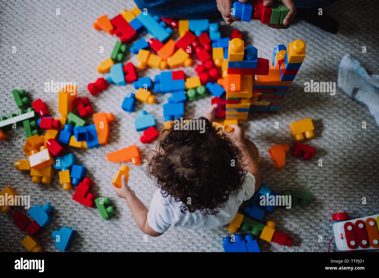 Toddler playing with blocks Stock Photo