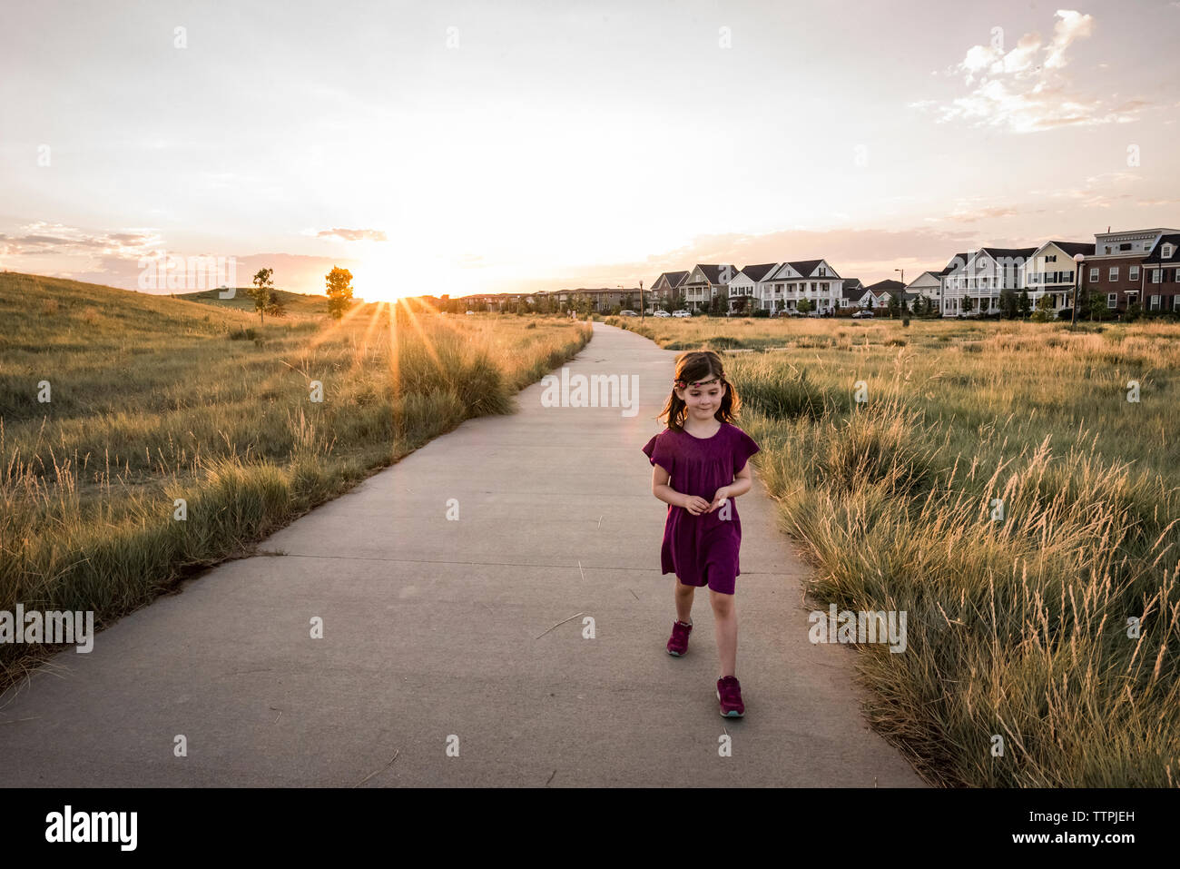 Girl walking road hi-res stock photography and images - Alamy