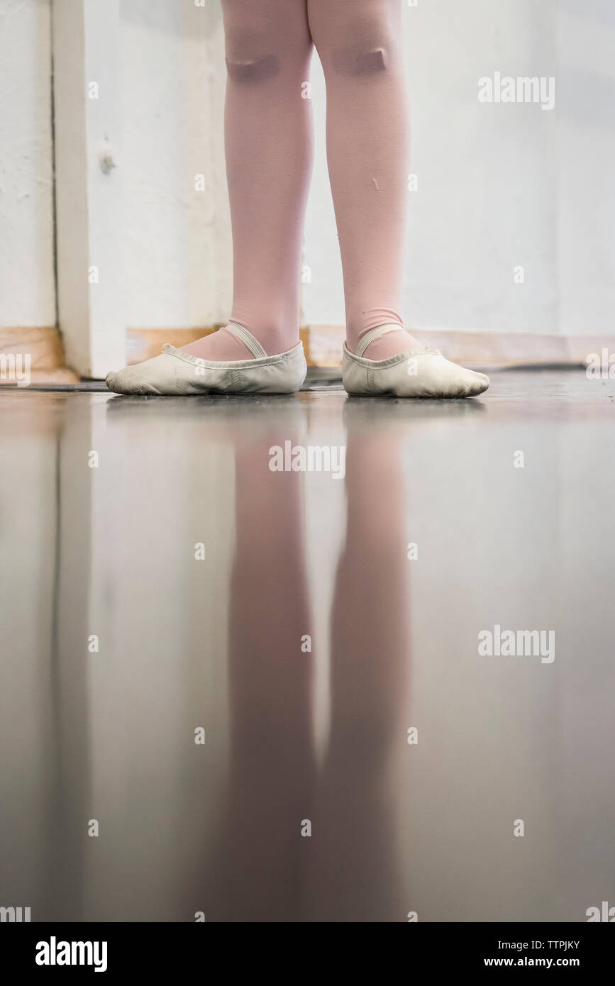 Low section of girl practicing ballet at home Stock Photo
