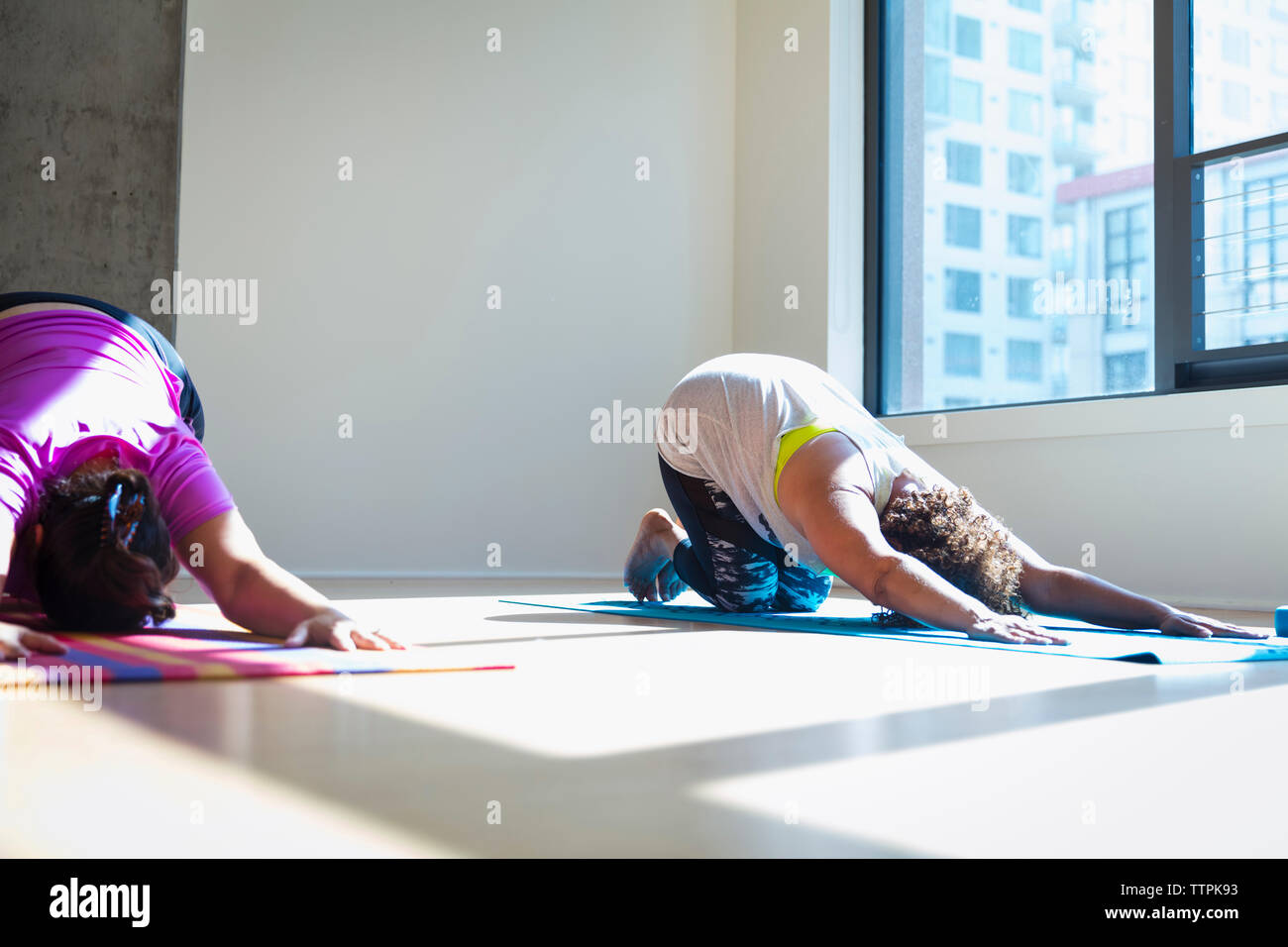 Two mature women bending over hi-res stock photography and images - Alamy