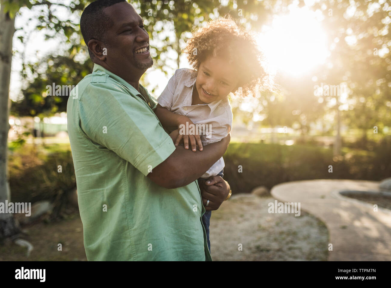 Father carrying his son hi-res stock photography and images - Alamy