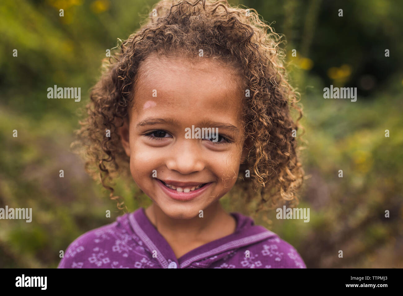 Mixed girl curly hair hi-res stock photography and images - Alamy