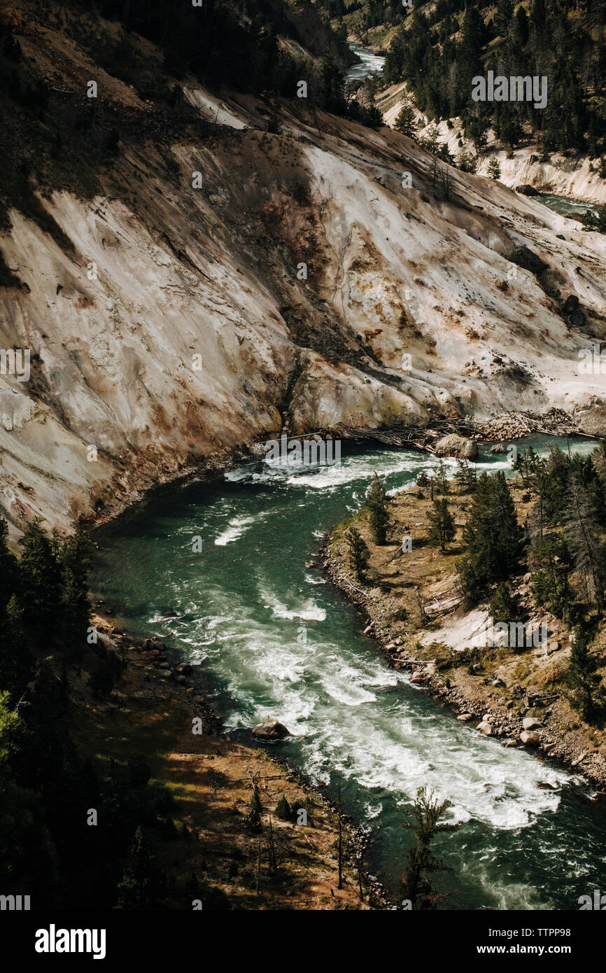 High angle view of Yellowstone River flowing by mountain in forest Stock Photo