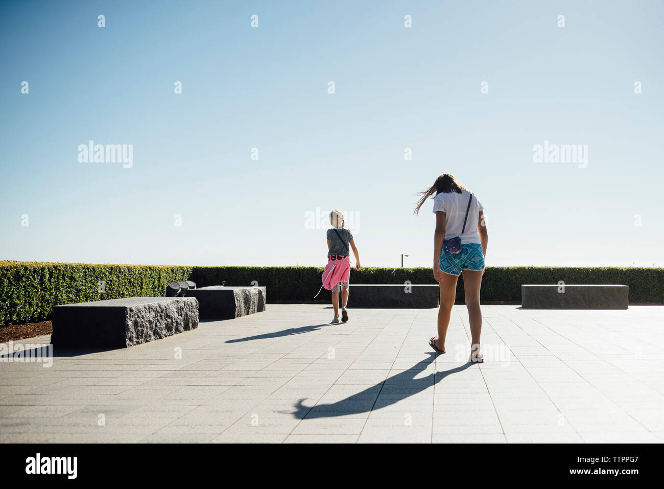 Two girls walking together hi-res stock photography and images - Alamy