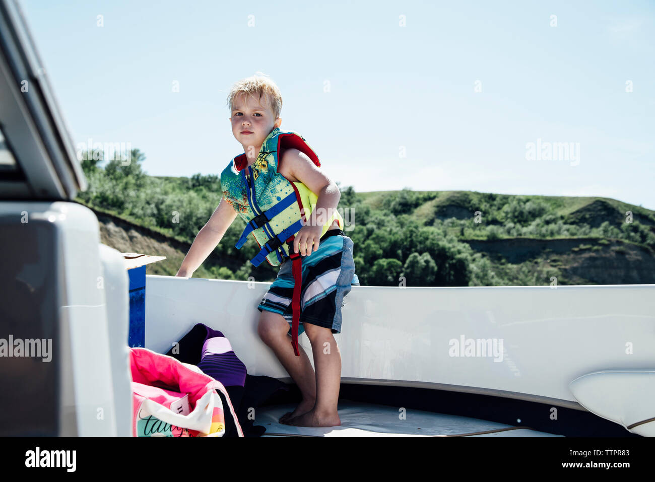 Boy boat wearing life jacket hi-res stock photography and images - Alamy