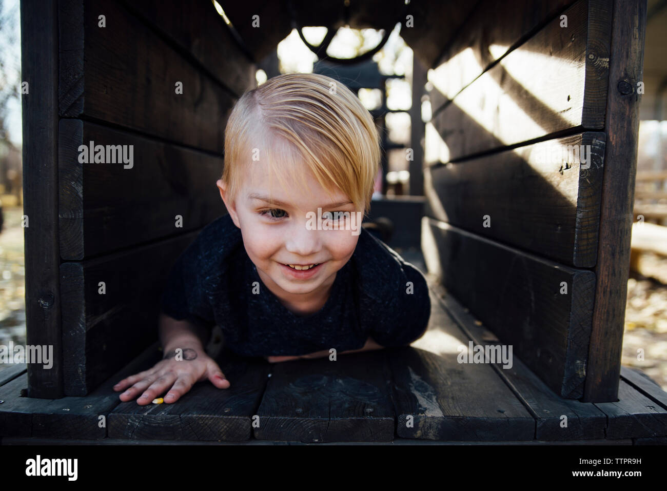 Boy playing on wood hi-res stock photography and images - Alamy