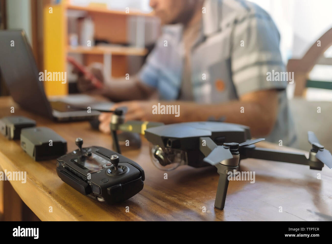 Midsection of engineer using laptop at table in office Stock Photo