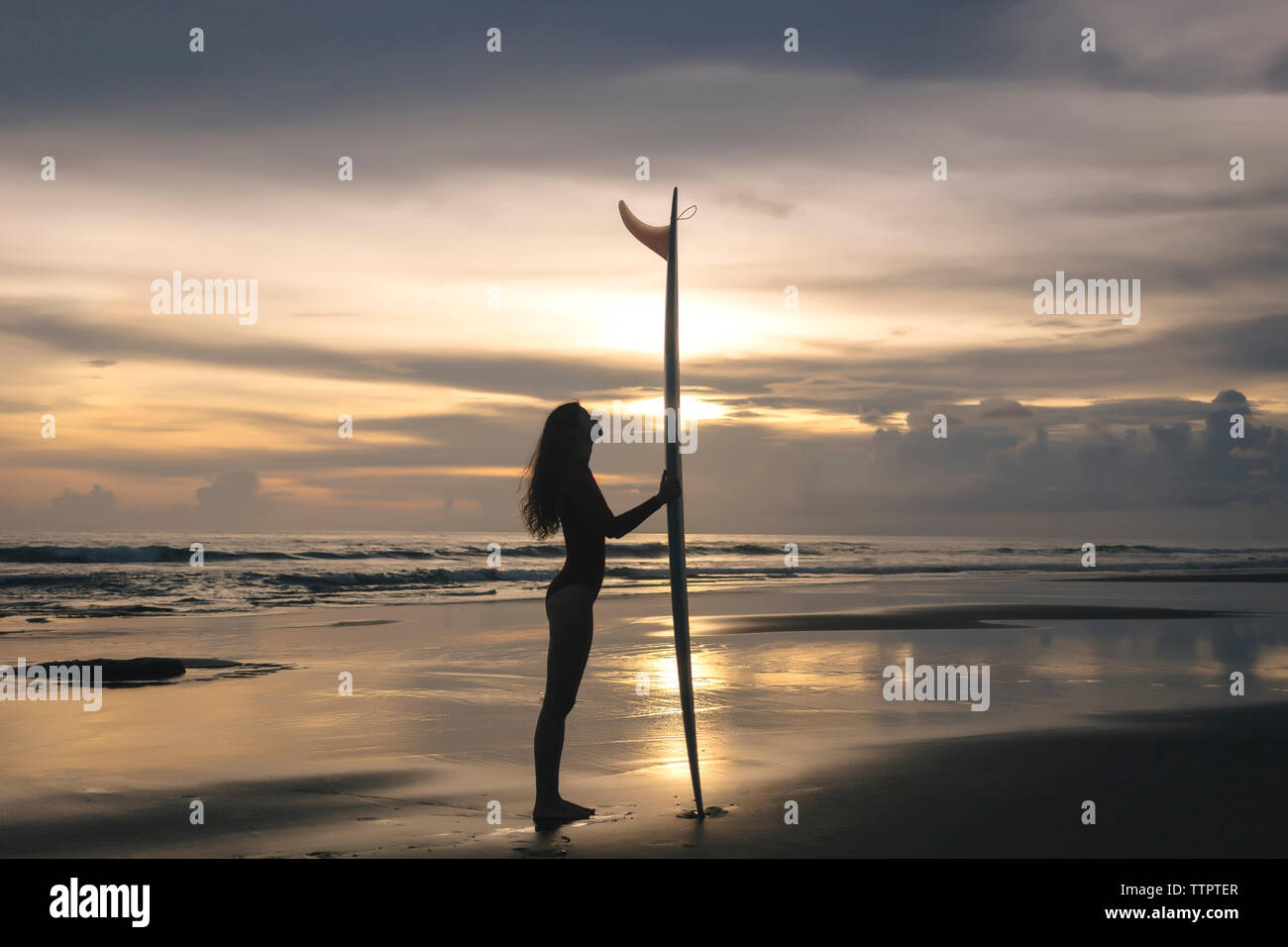 Side view old woman surfboard hi-res stock photography and images - Alamy