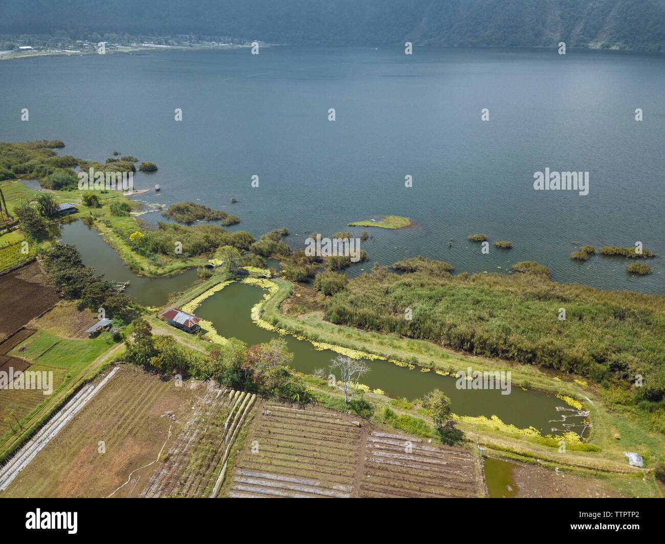 Aerial view of landscape by river Stock Photo - Alamy