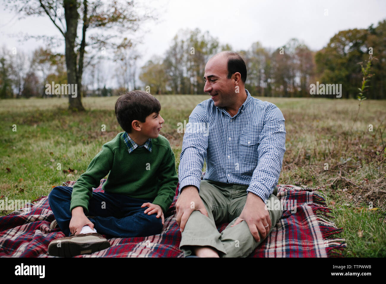 Mature father and son sitting hi-res stock photography and images - Alamy