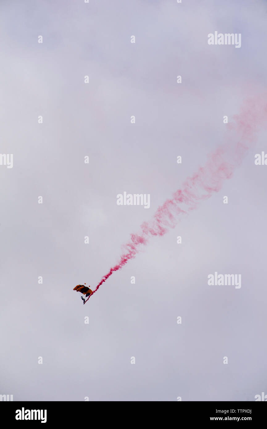 Low angle view of paratrooper during airshow Stock Photo