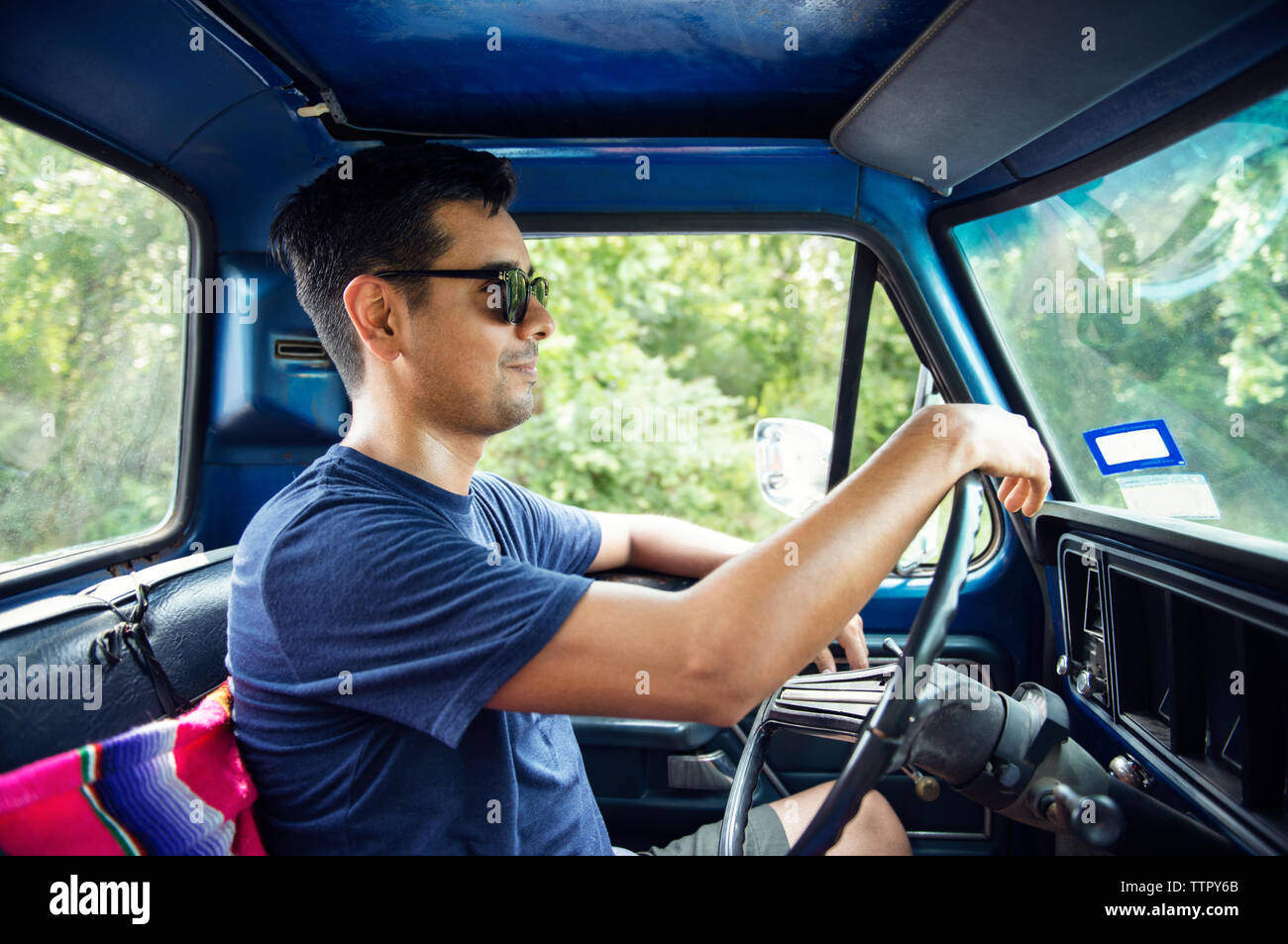 Man in sunglasses driving pickup truck Stock Photo Alamy