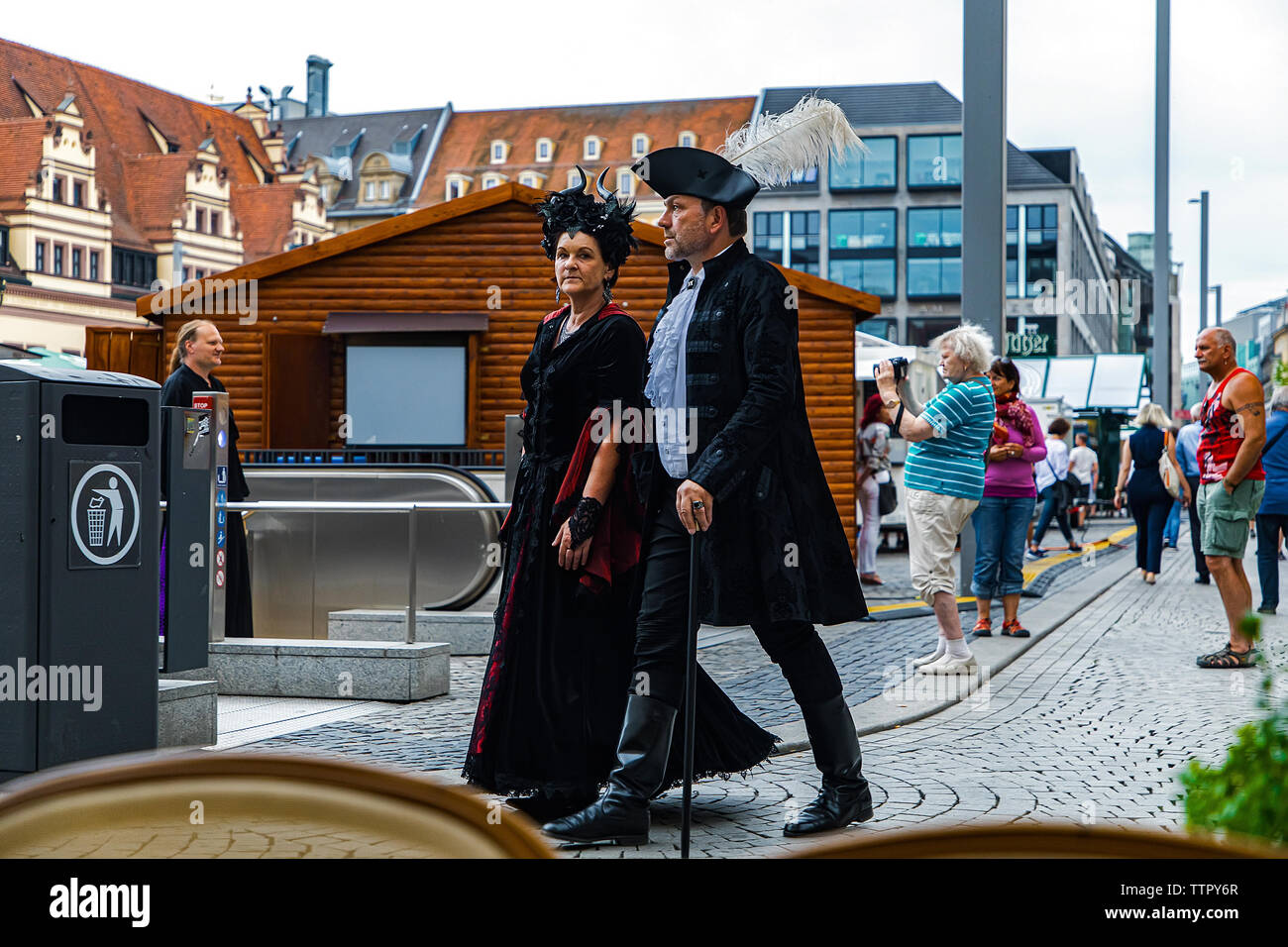 Leipzig, Germany , Juny 9, 2019 . Festive people in black and red gothic  and steampunk costumes at the street Stock Photo