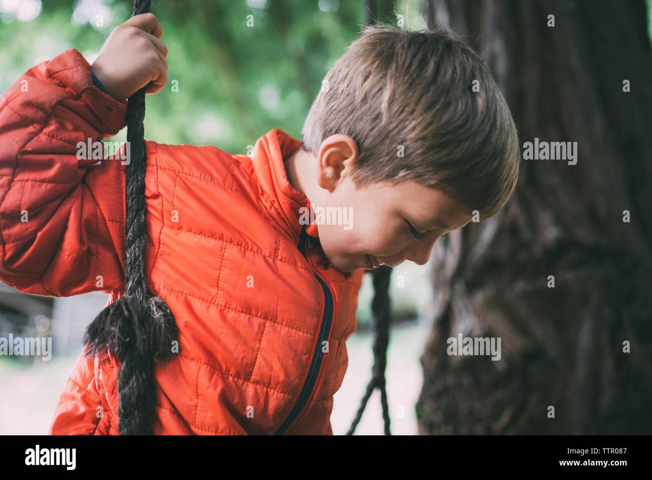 Boy Using A Rope Boy on rope swing hi-res stock photography and images - Alamy