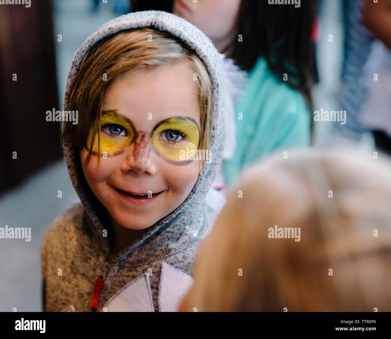 Portrait of cute smiling boy with face paint wearing costume during Halloween Stock Photo