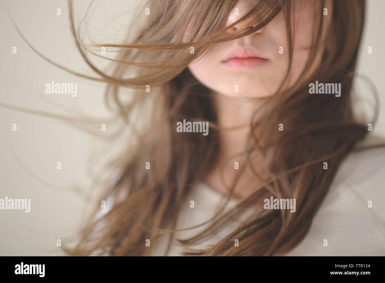 Midsection Of Girl With Tousled Hair At Home Stock Photo