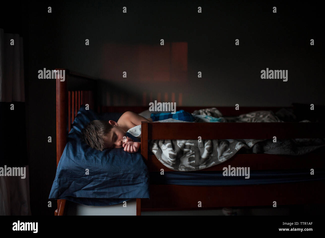 Boy dark home hi-res stock photography and images - Alamy