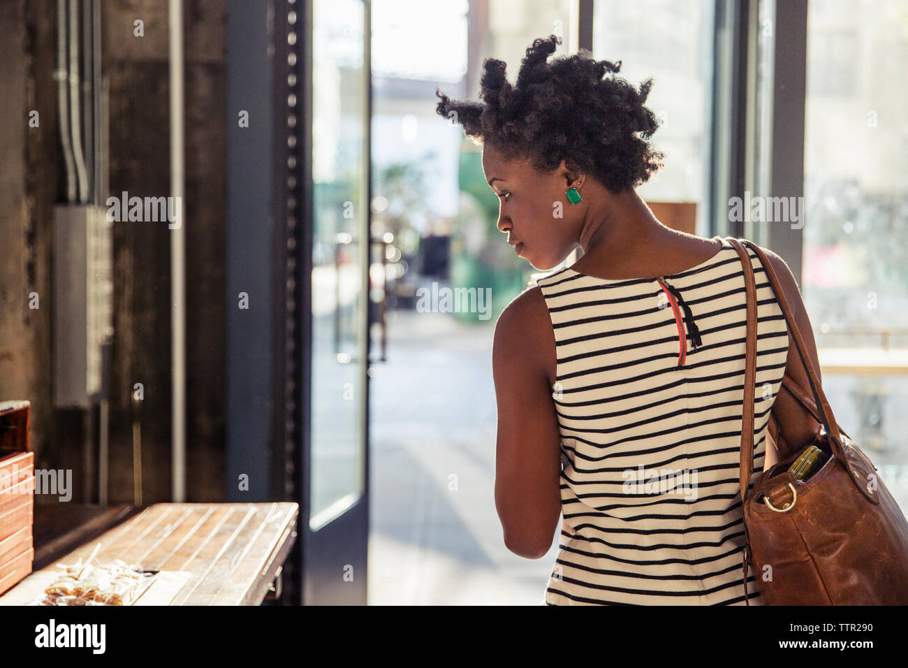 Rear view of woman in restaurant Stock Photo
