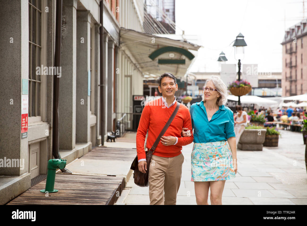 Mature man woman walking arm hi-res stock photography and images - Alamy