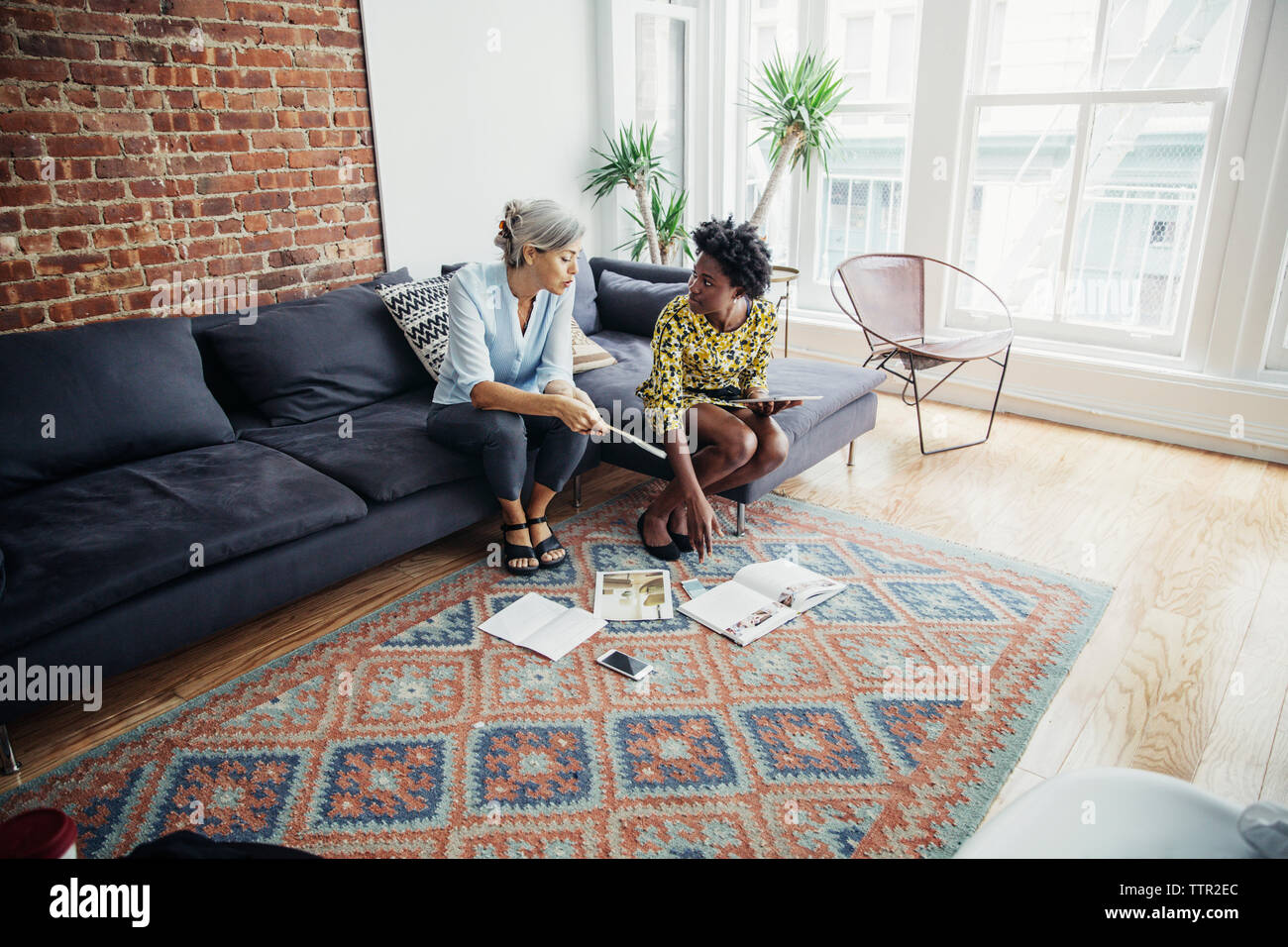 businesswomen discussing on creative office Stock Photo