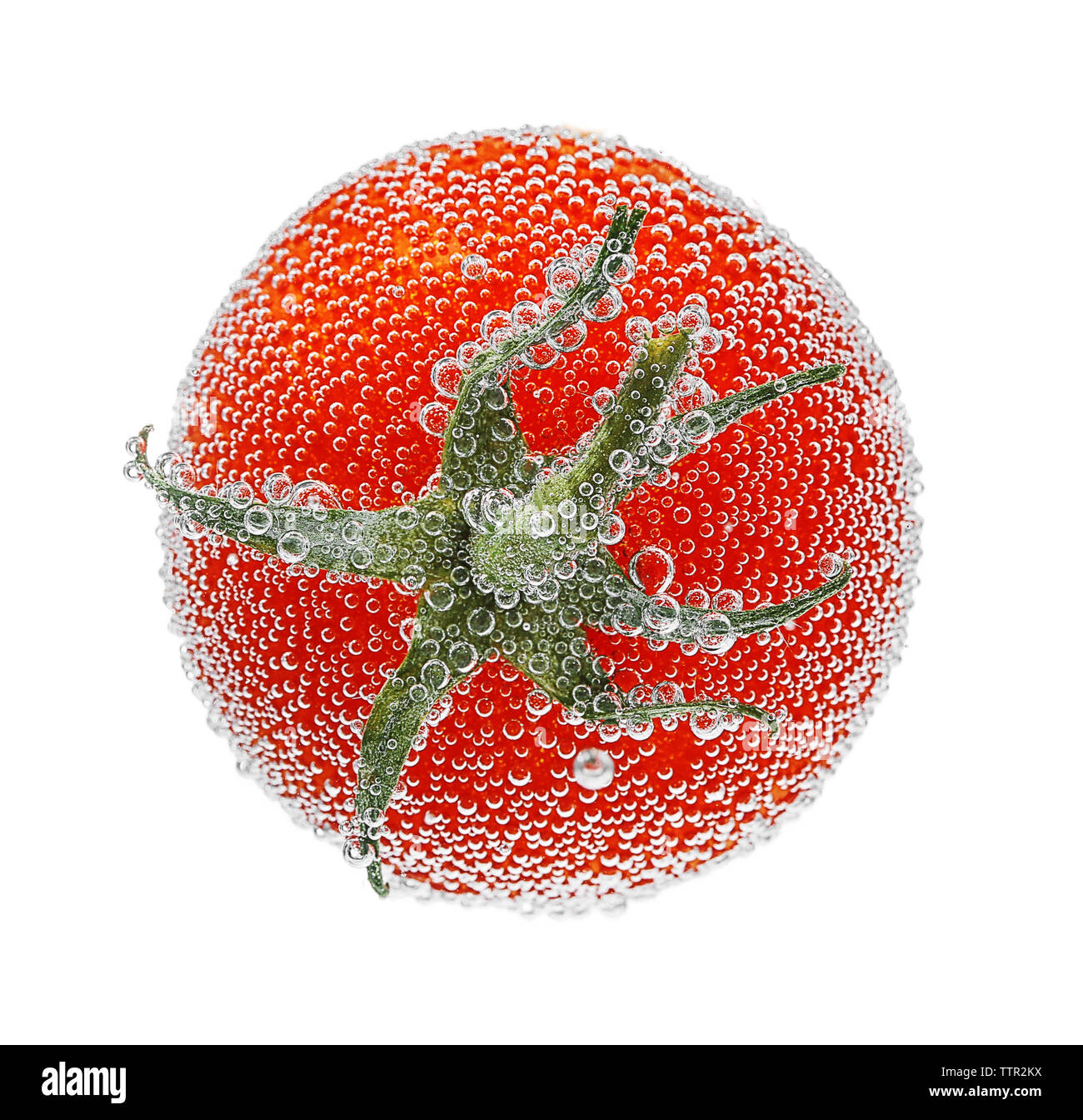 Tomato in a water on white background Stock Photo - Alamy