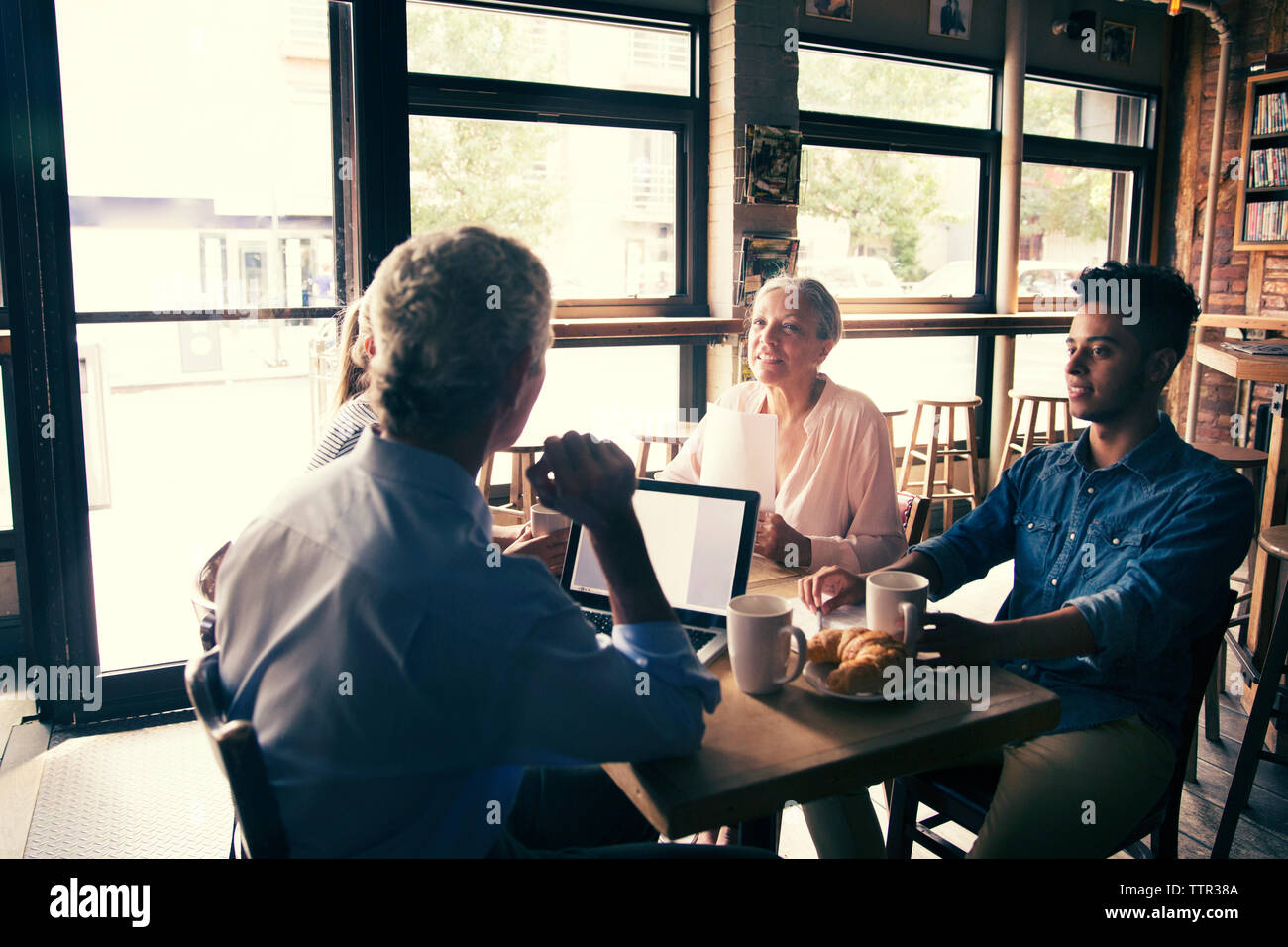 businessman discussing in meeting while having coffee at cafe Stock Photo