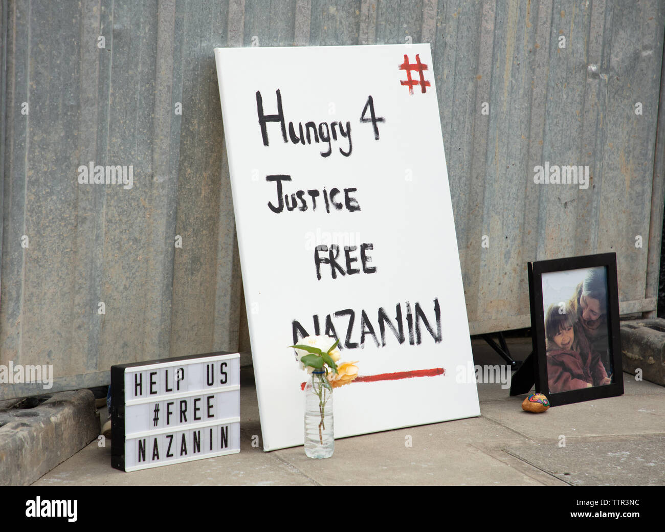 London, UK. 17th June 2019.Family photo and supporting words for Richard Ratcliffe who is on hunger strike in front of the Iranian embassy in London in protest of the detention of his wife Nazanin Zaghari in Iran over spying allegations. Credit: Joe Kuis / Alamy Stock Photo