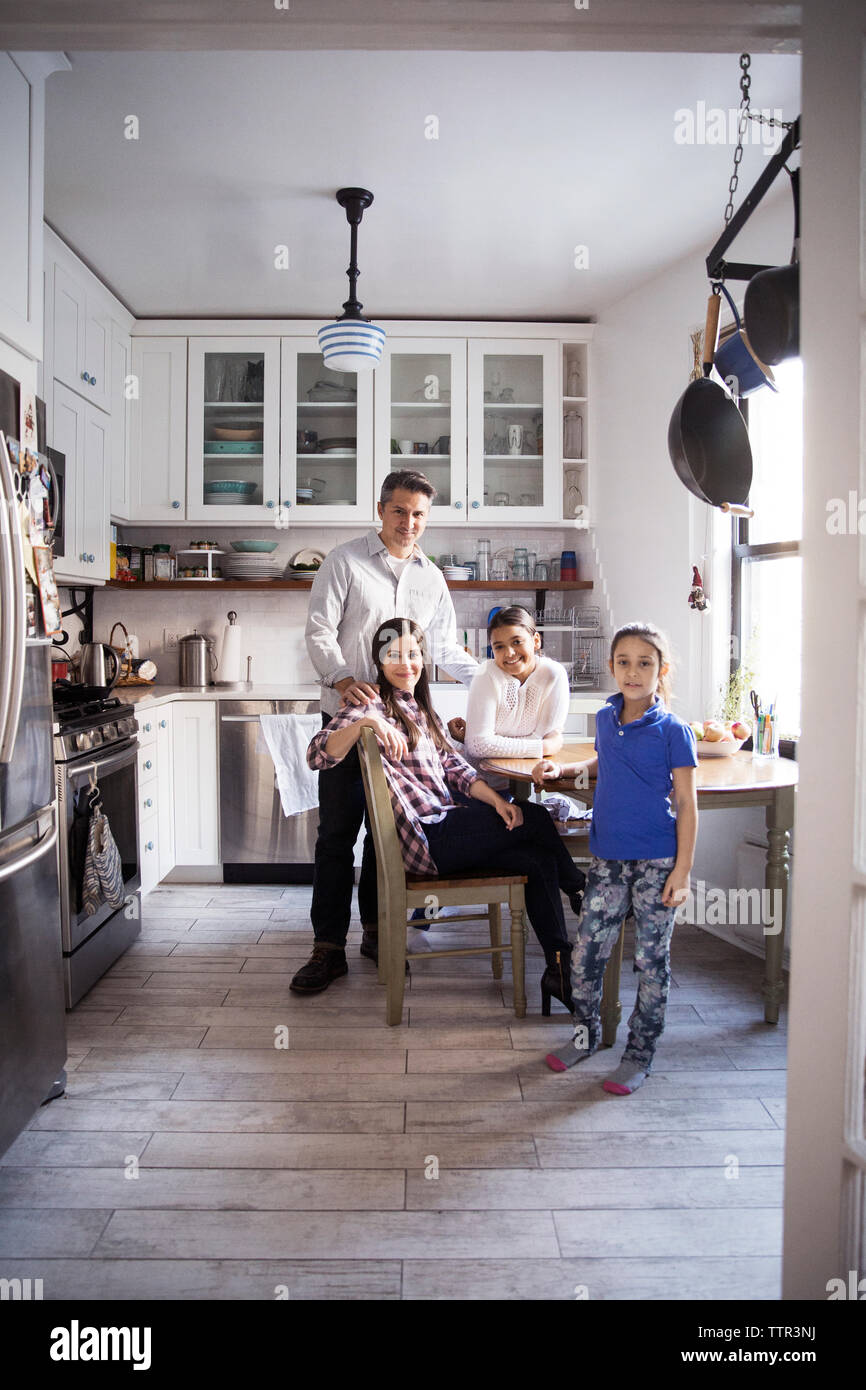 Family together smiling kitchen hi-res stock photography and images - Alamy