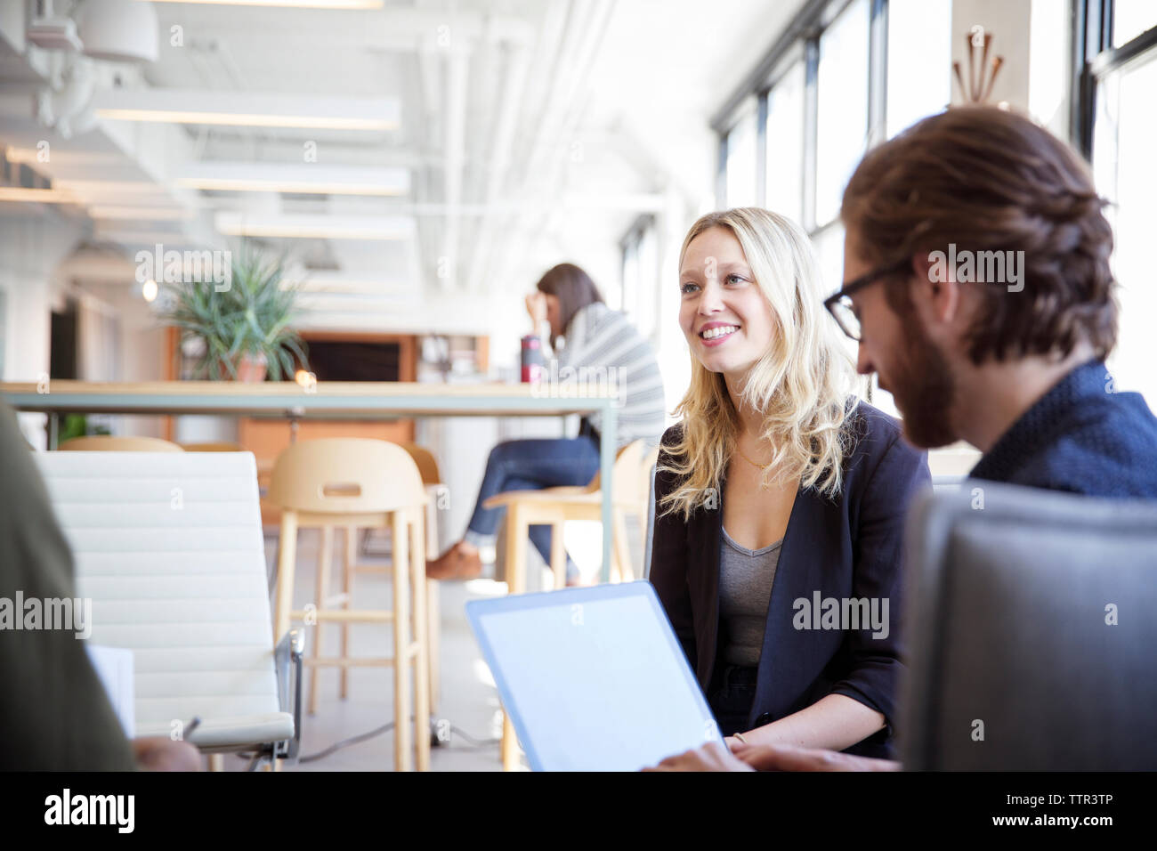 businessman using laptop computer while planning with colleagues in office Stock Photo