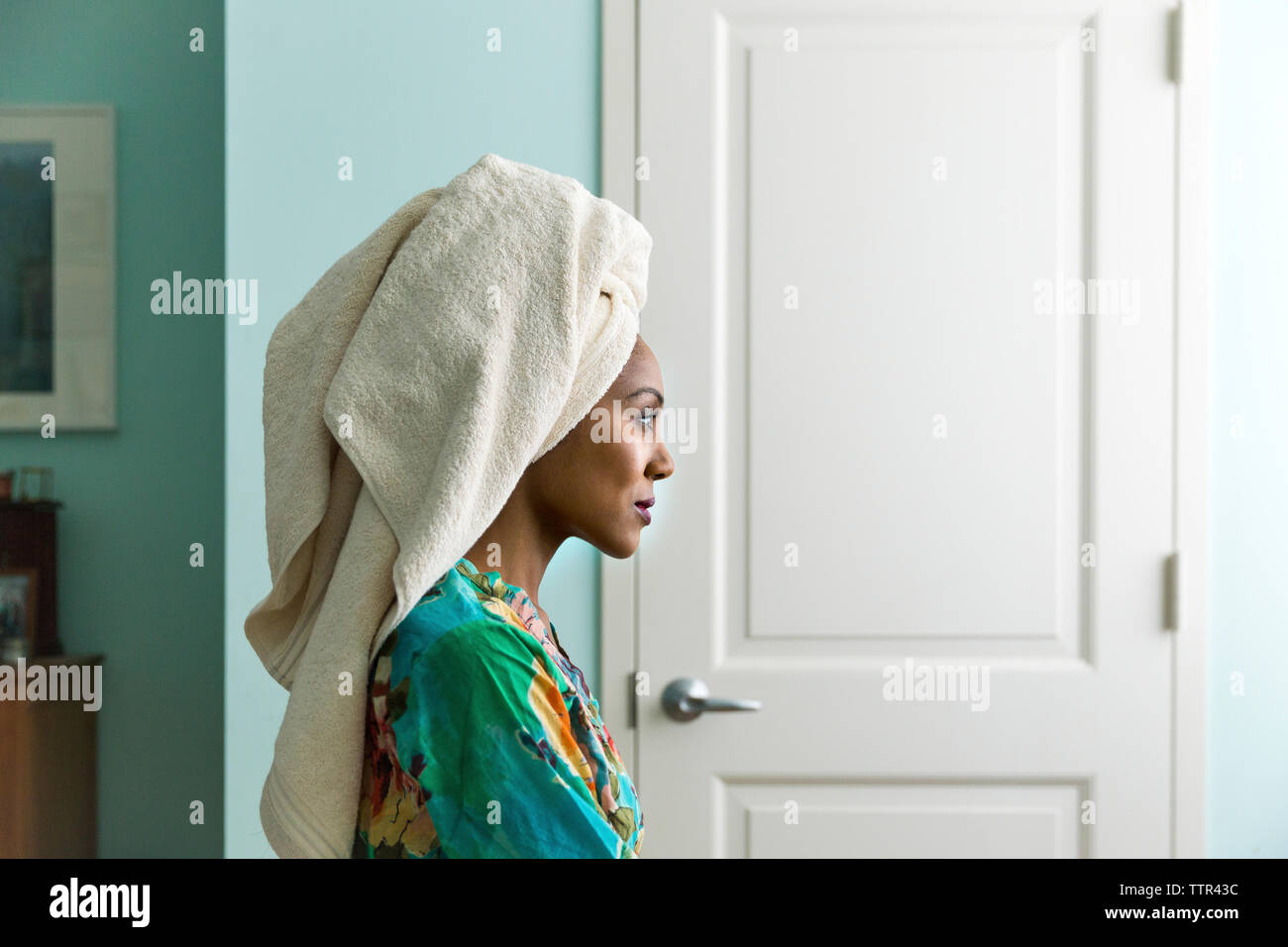 Side view woman looking away while wearing towel on head Stock Photo