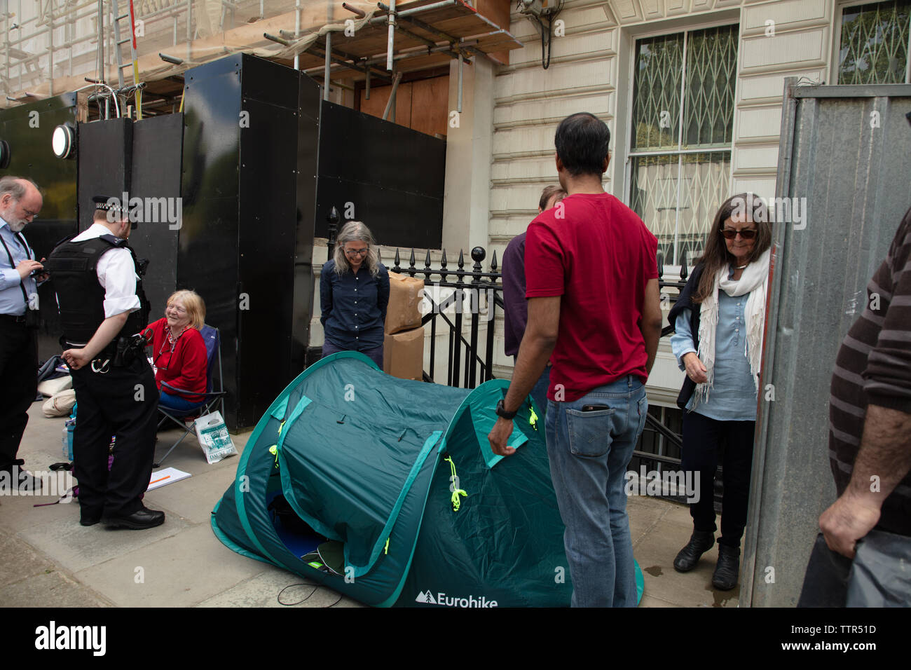 London, UK. 17th June 2019. Richard Ratcliffe on hunger strike in front of the Iranian embassy in London in protest of the detention of his wife Nazanin Zaghari in Iran over spying allegations. Richard is forced to put his tent forwards as builders are planning to pressure clean the front of the building. Credit: Joe Kuis / Alamy Stock Photo